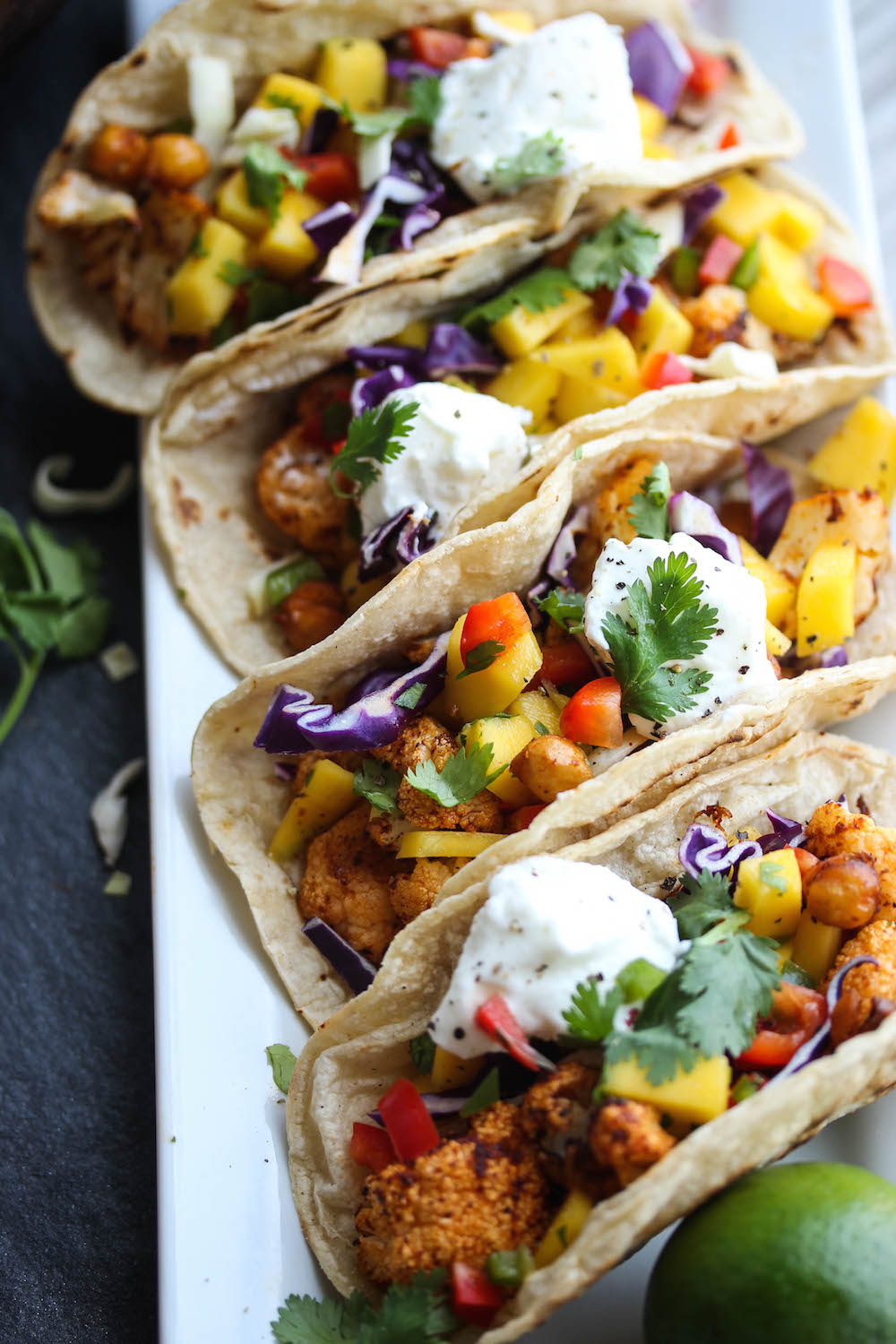 Chili Cauliflower Chickpea Tacos with Mango Salsa | dishingouthealth.com