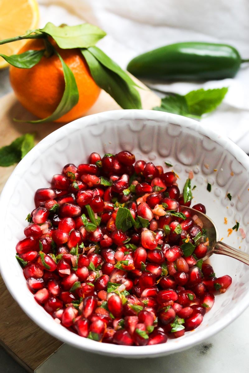 Pomegranate salsa mixed in a white bowl