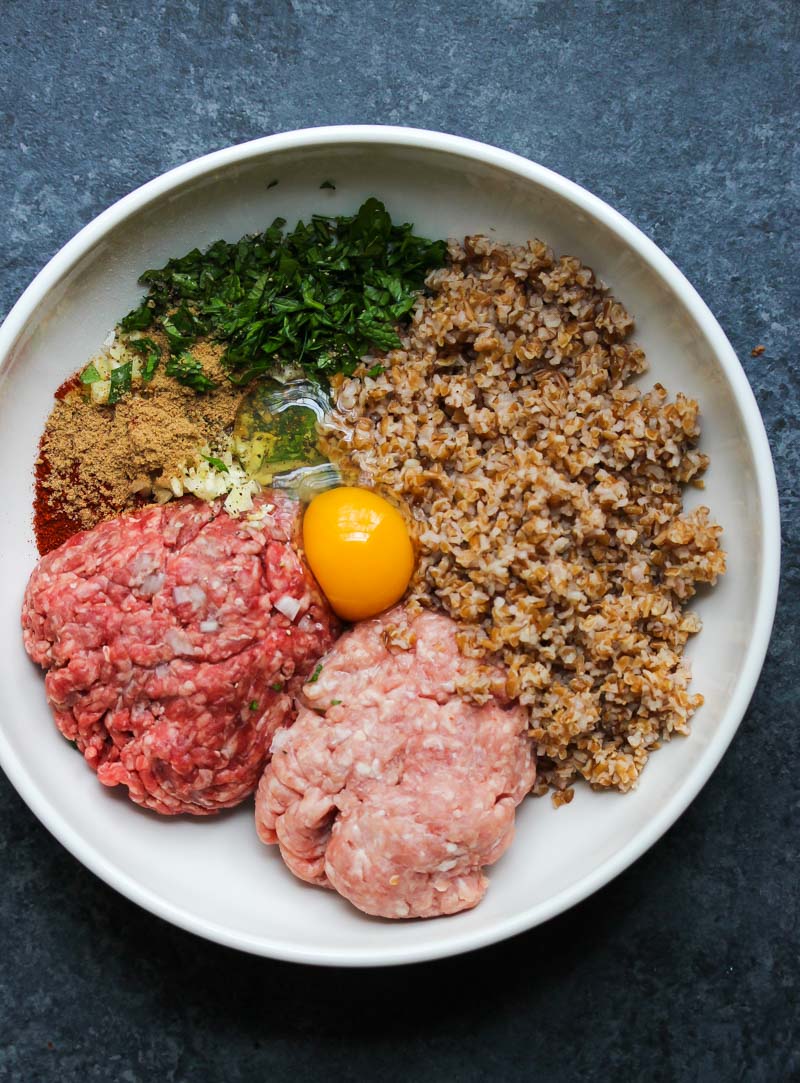 Beef and Bulgur Meatballs in Pomegranate Sauce | dishingouthealth.com