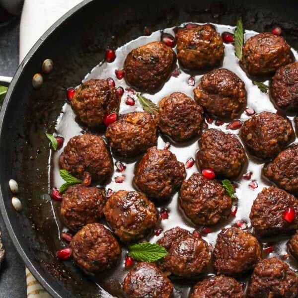 Beef and Bulgur Meatballs in Pomegranate Sauce | dishingouthealth.com