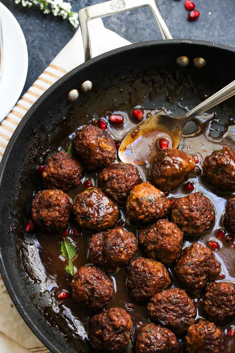 Beef and Bulgur Meatballs in Pomegranate Sauce | dishingouthealth.com