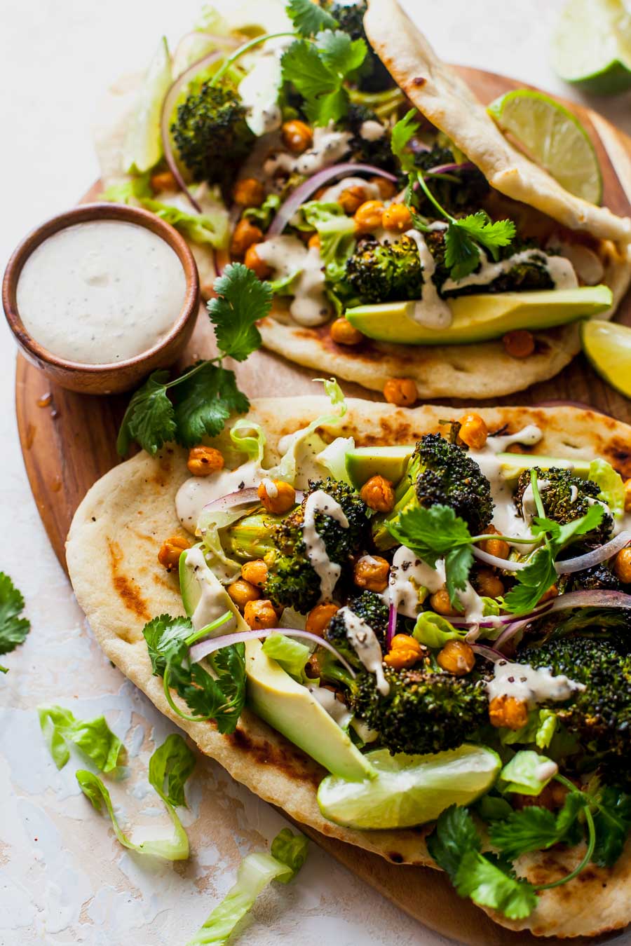 Buffalo Broccoli and Chickpea Pitas with Tahini Caesar