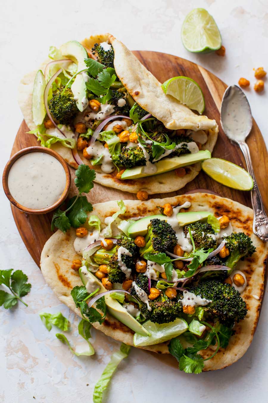 Buffalo Broccoli and Chickpea Pitas with Tahini Caesar