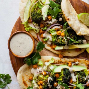 Buffalo Broccoli and Chickpea Pitas with Tahini Caesar