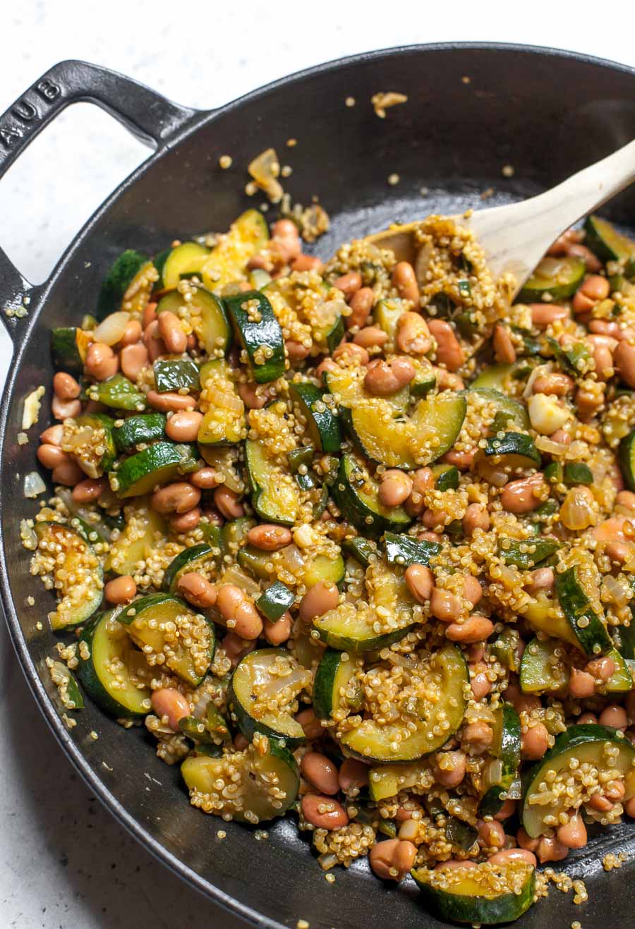 Sautéed vegetables, quinoa, and pinto beans