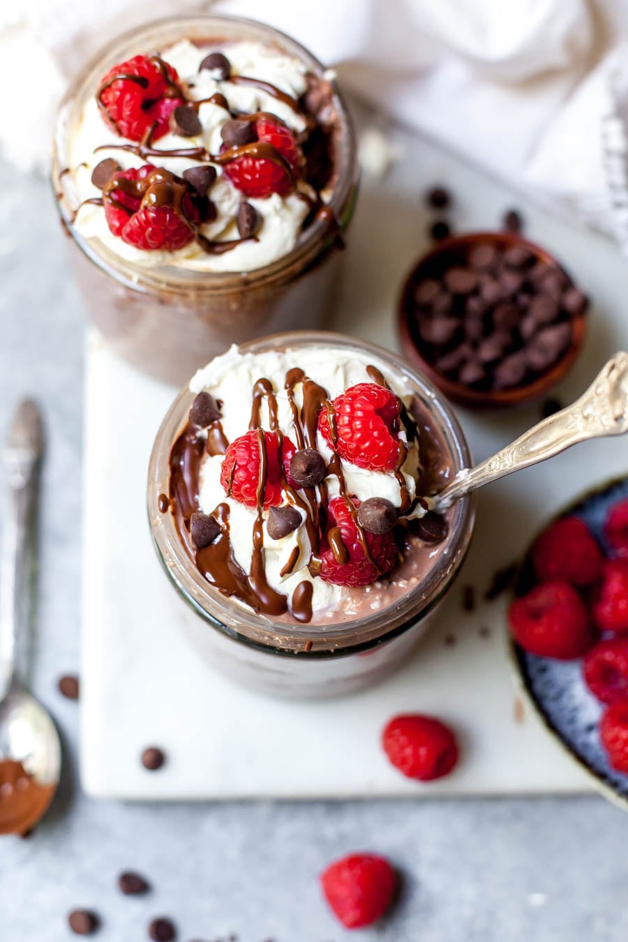 Brownie Batter Overnight Oats in a Jar with Dark Chocolate and Raspberries