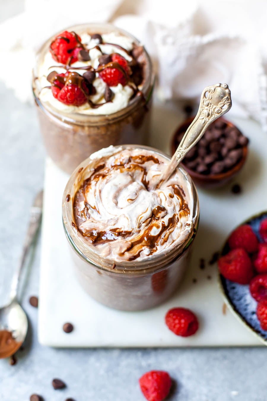 Brownie Batter Overnight Oats topped with yogurt and berries