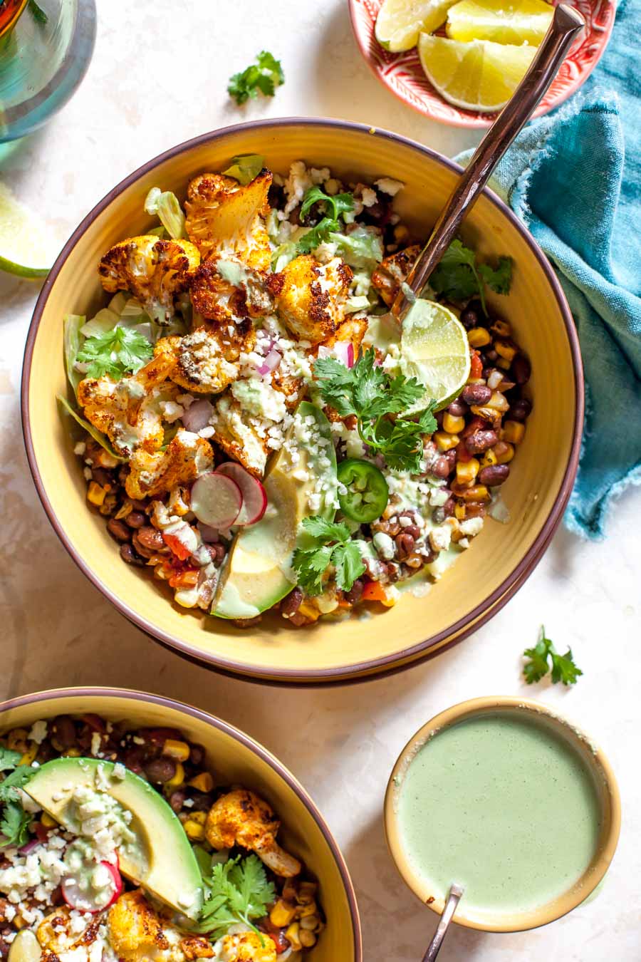 Roasted Cauliflower Burrito Bowls with chipotle black beans and Jalapeño Ranch dressing