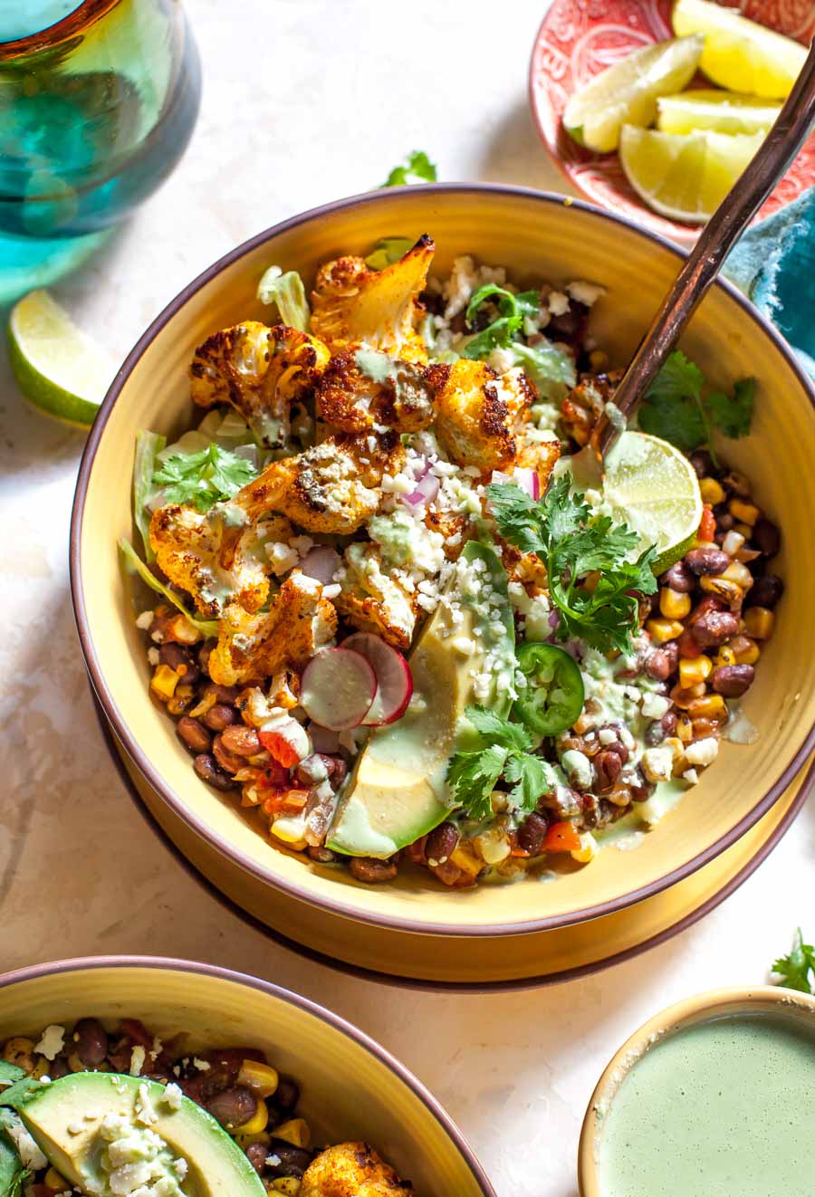 Roasted Cauliflower Burrito Bowls with chipotle-style black beans and Jalapeño Ranch