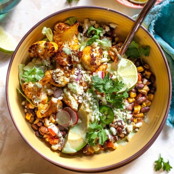 Roasted Cauliflower Burrito Bowls with chipotle-style black beans and Jalapeño Ranch