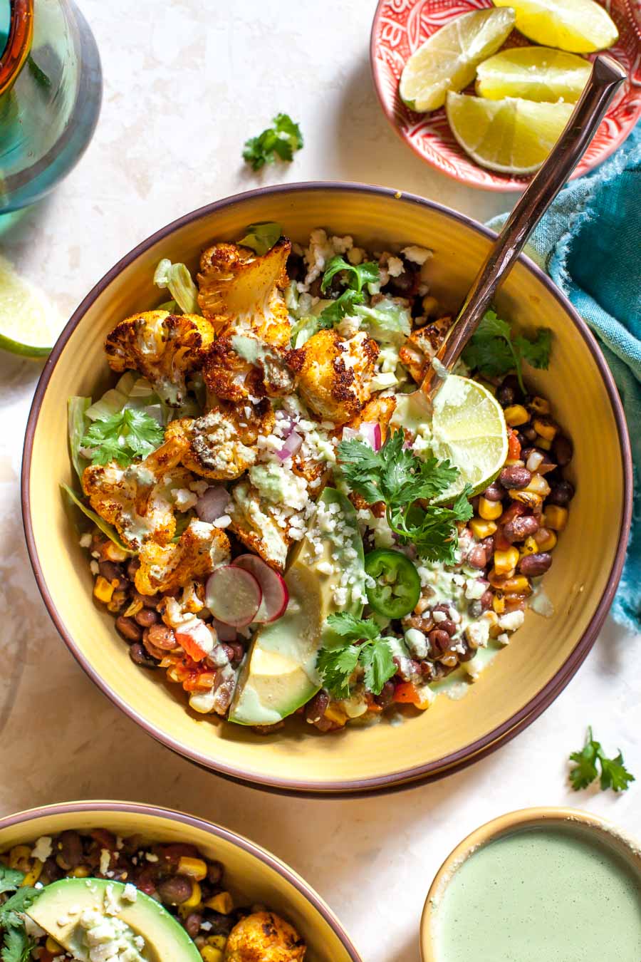 Roasted Cauliflower Burrito Bowls with chipotle-style black beans and Jalapeño Ranch