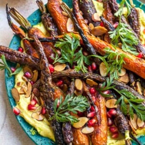 Curried Yogurt Topped with Baked Carrots, Almonds, and Pomegranate