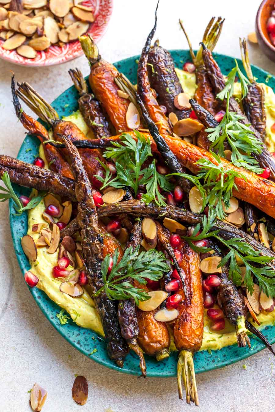 Curried Yogurt Topped with Baked Carrots, Almonds, and Pomegranate