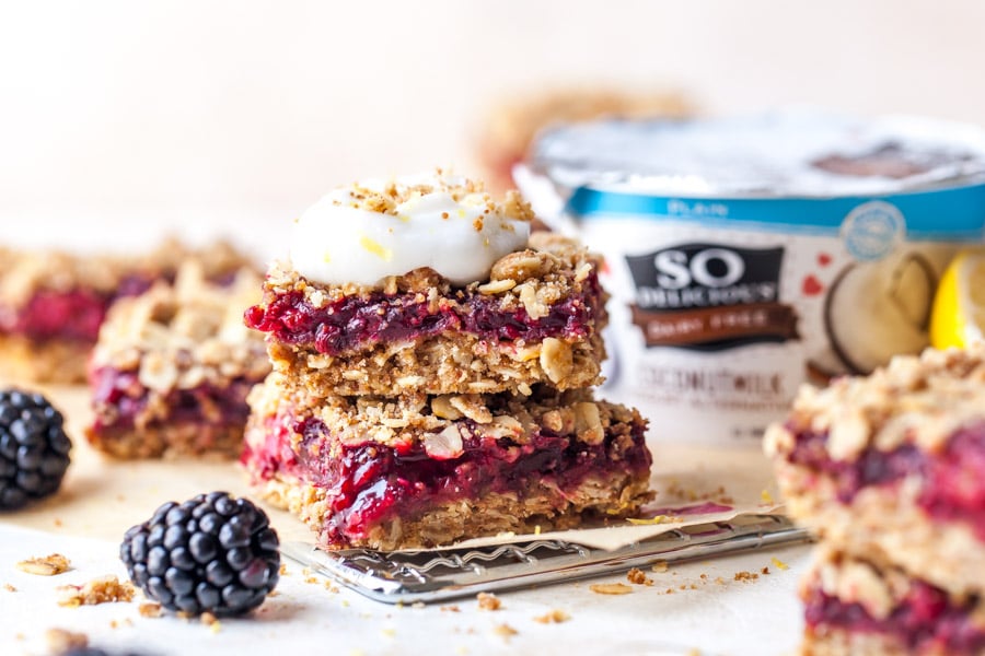 Blackberry Crumble Bars topped with a dollop of coconutmilk yogurt