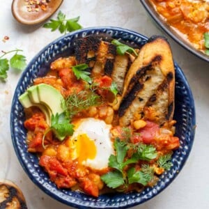 Poached Eggs in Curried Tomato Sauce with Beans