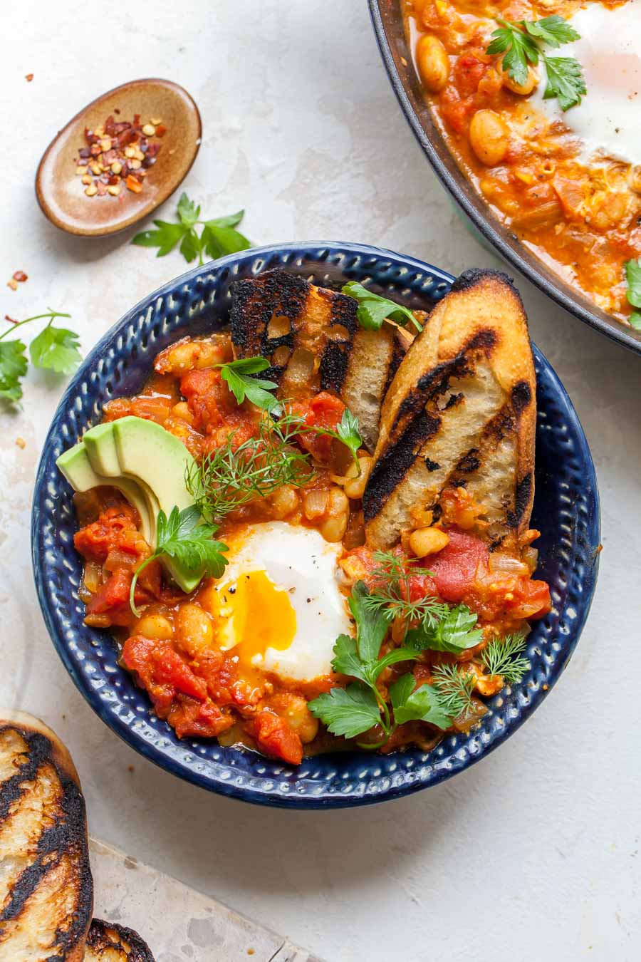 Poached Eggs in Curried Tomato Sauce with Beans