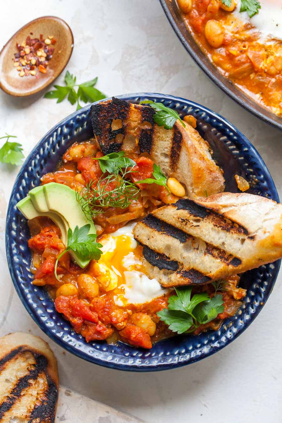 Coconut-Curry Poached Eggs Served with Grilled Bread