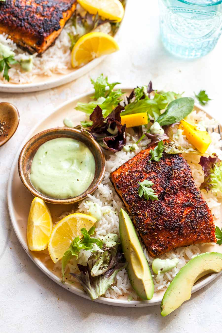 Blackened salmon fillets with coconut rice and avocado ranch dressing