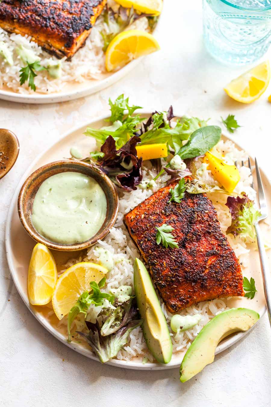 Grilled fish with coconut rice and avocado yogurt sauce