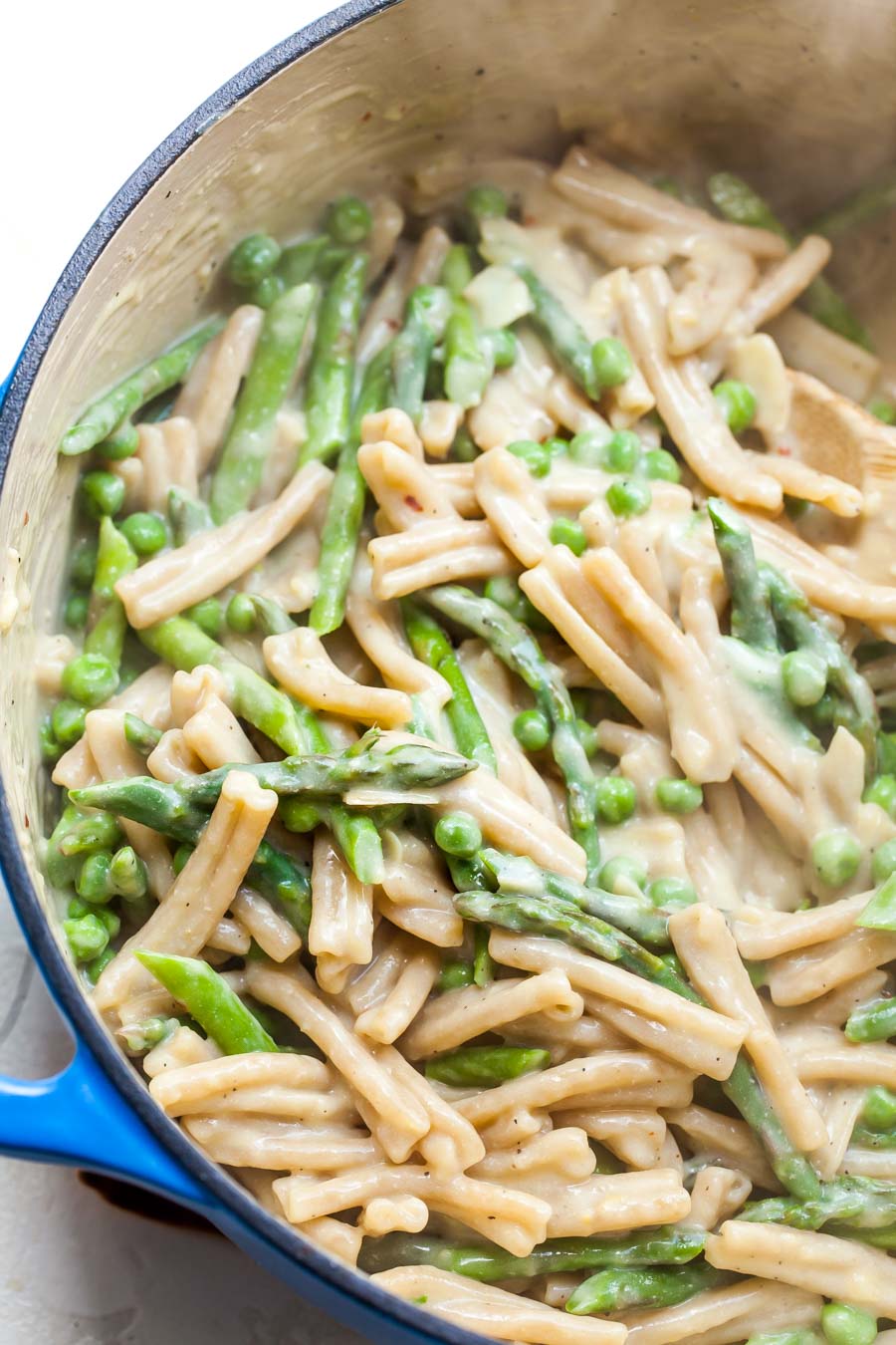 Creamy vegetable pasta cooking in a pot