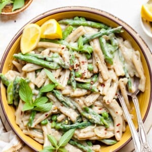 Finished pasta in a bowl with a fork