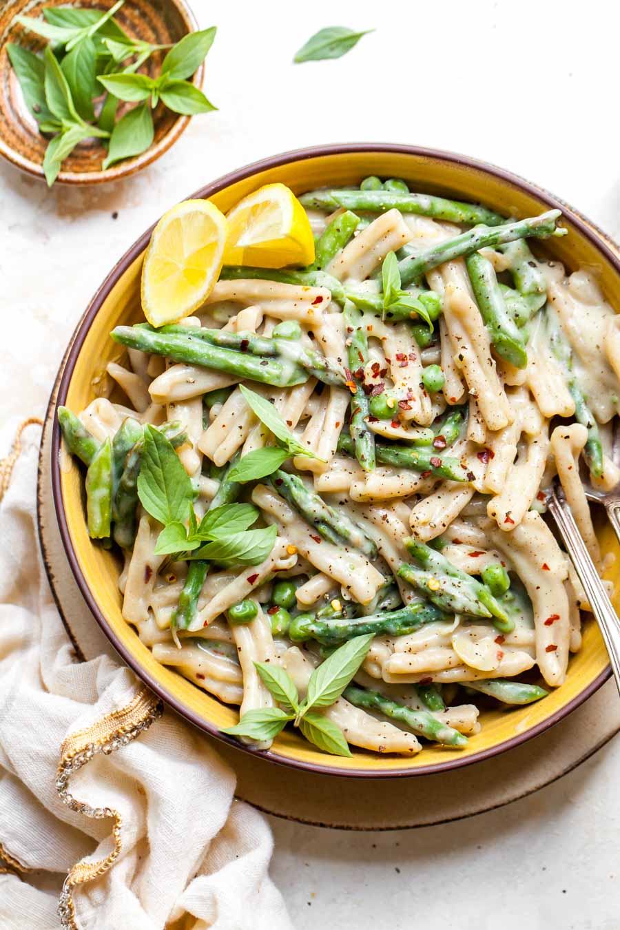 Creamy pasta in a yellow bowl