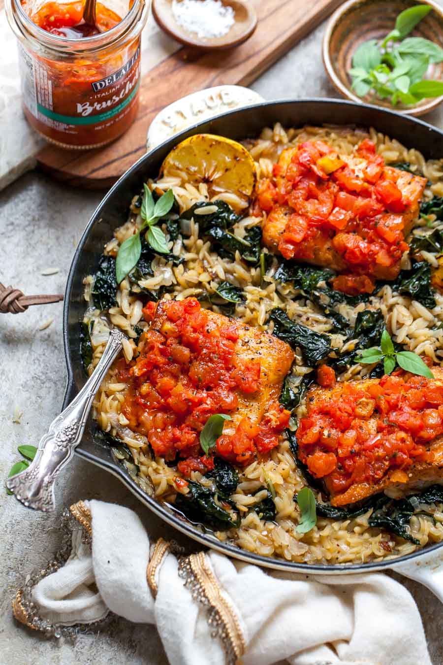 Salmon and orzo topped with tomato bruschetta