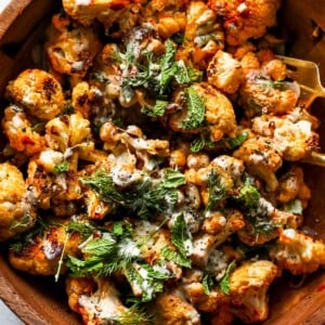 Harissa Roasted Cauliflower and Chickpea Salad with Lemony Tahini