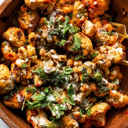 Harissa Roasted Cauliflower and Chickpea Salad with Lemony Tahini