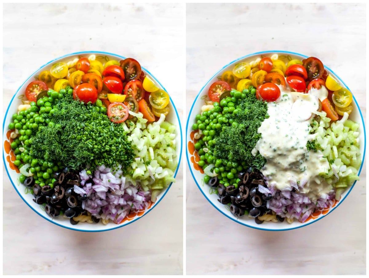 Pasta salad with tomatoes, celery, onions, peas, olives, and herbs with creamy dressing poured overtop