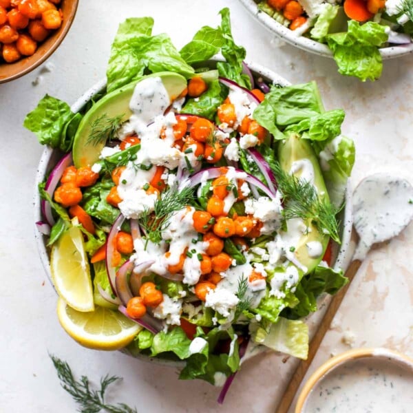 Buffalo chickpea romaine salad in a white bowl