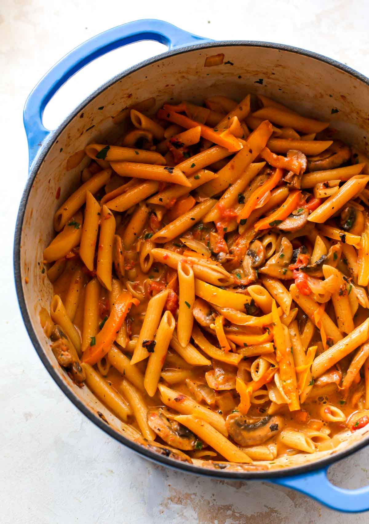 Creamy cajun shrimp pasta in a large blue pot