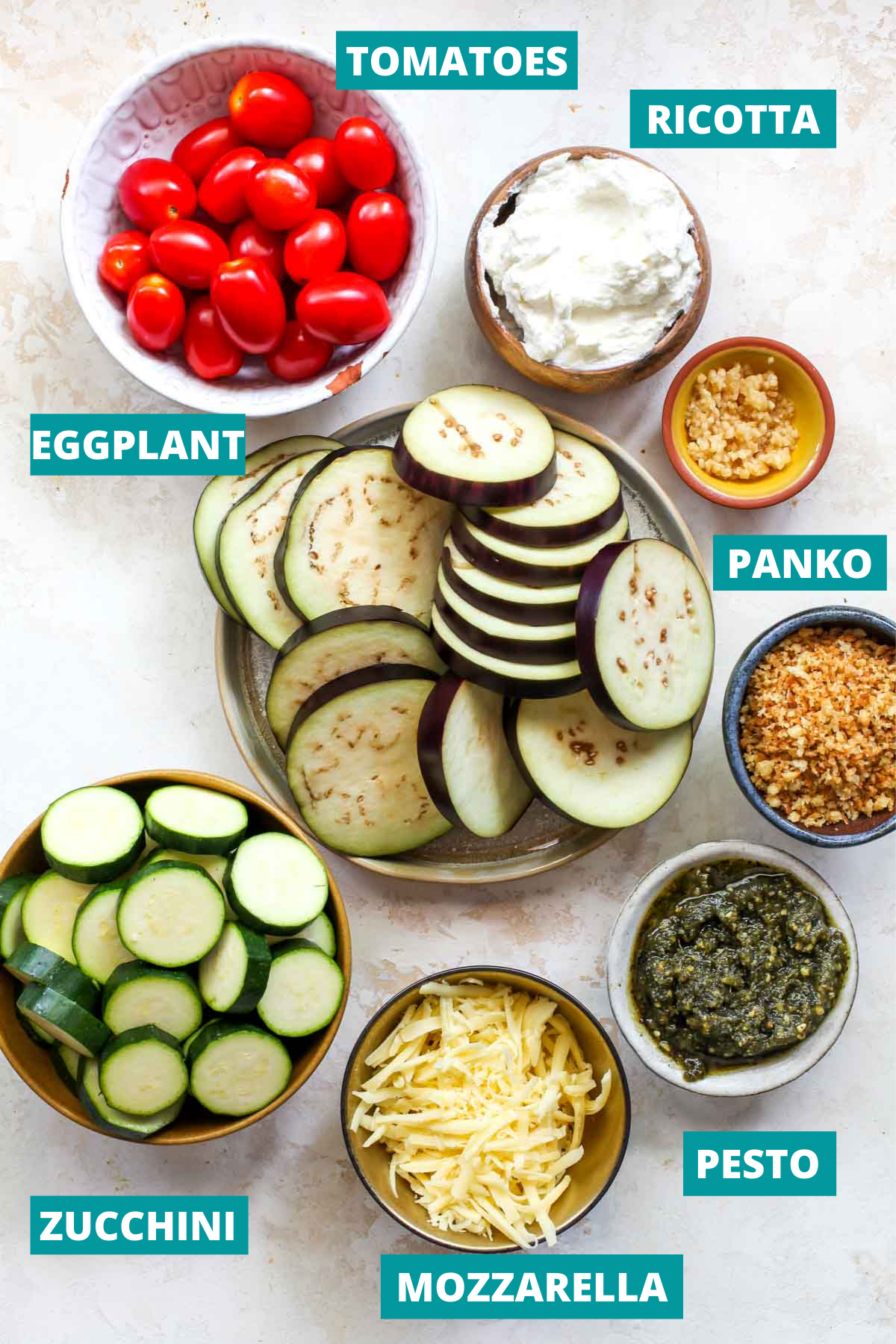 Recipe ingredients in separate bowls with blue labels