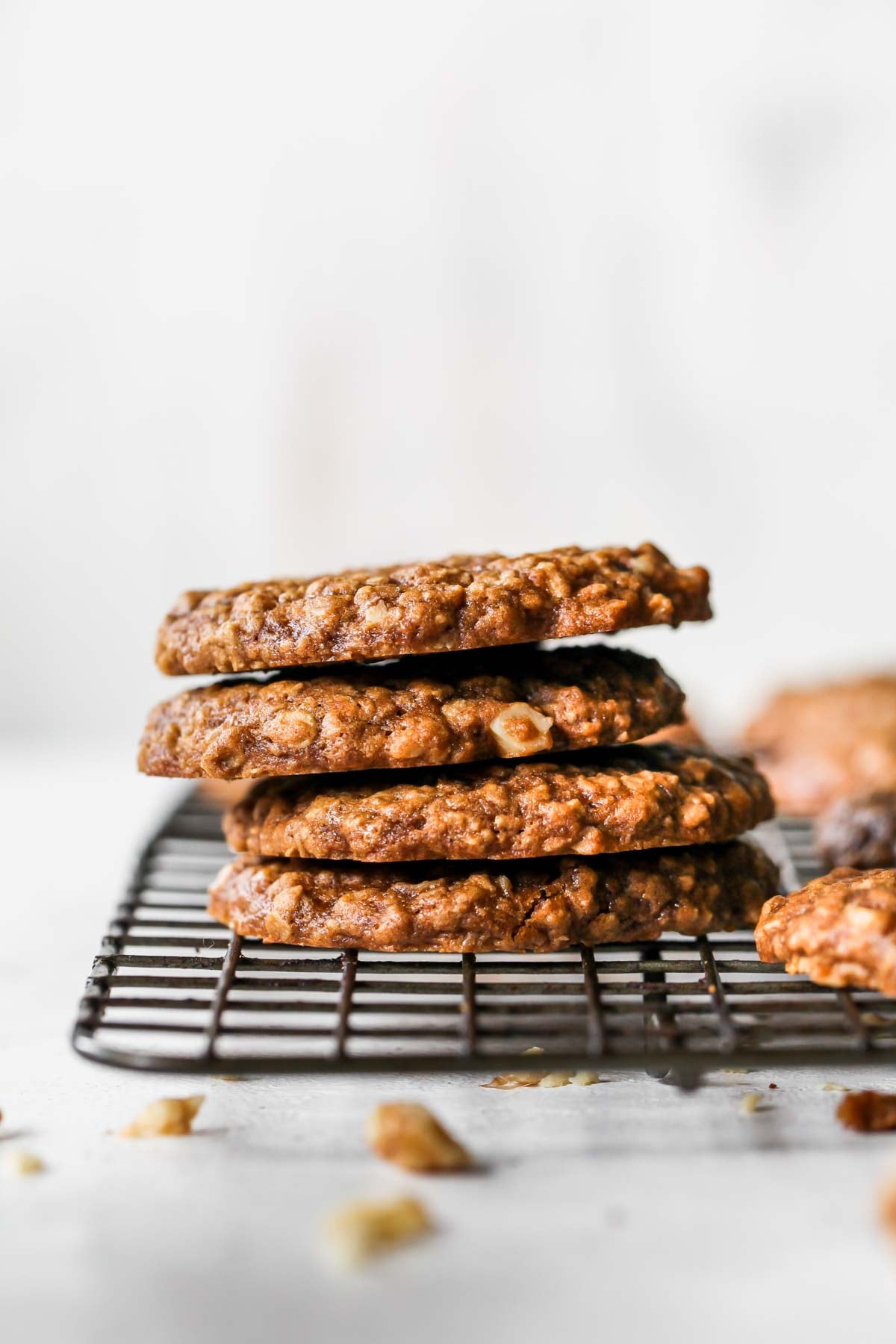 Four cookies stacked on each other on a cooling rack