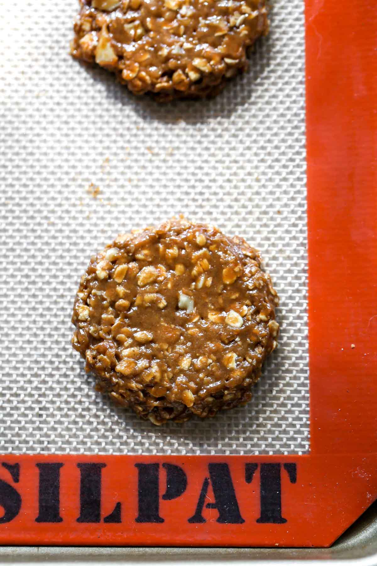Raw cookie dough on a silpat baking mat