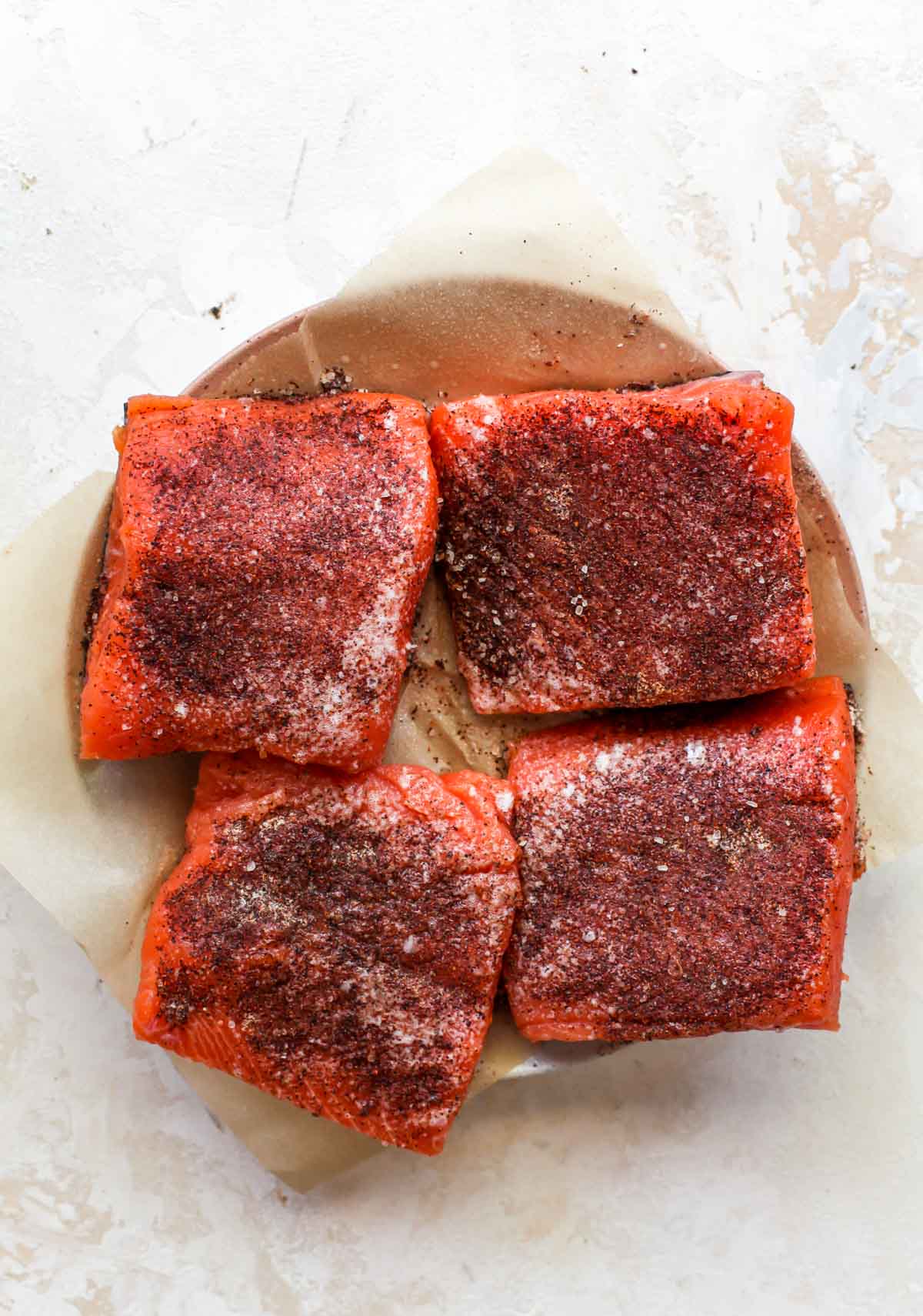 Salmon fillets with chili seasoning on a plate