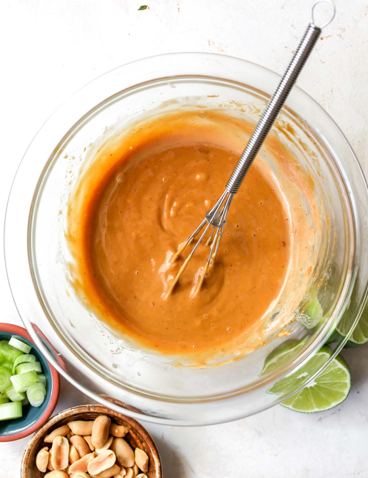 Firecracker peanut sauce being whisked in a bowl