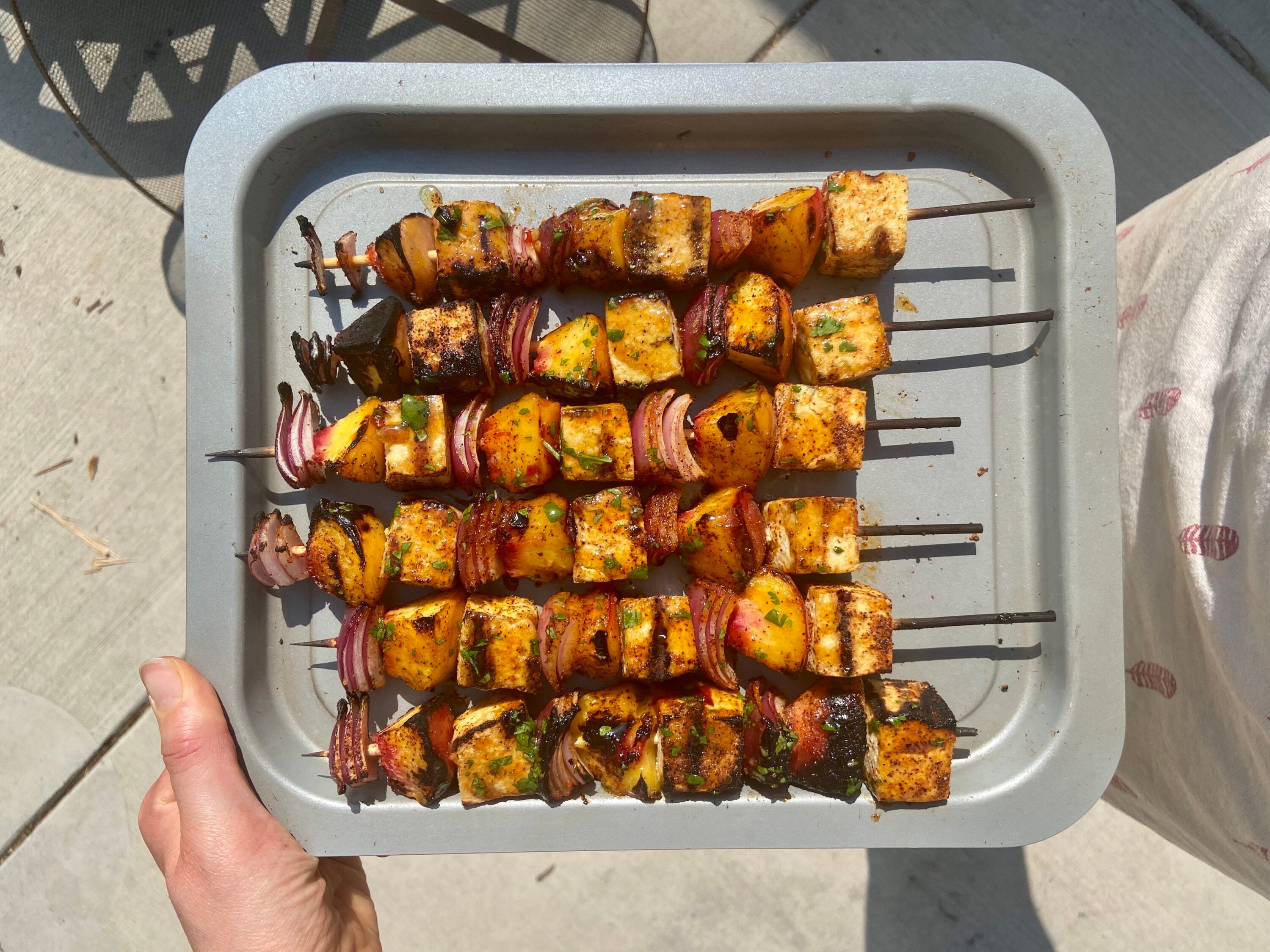 Tofu kebabs coming off the grill