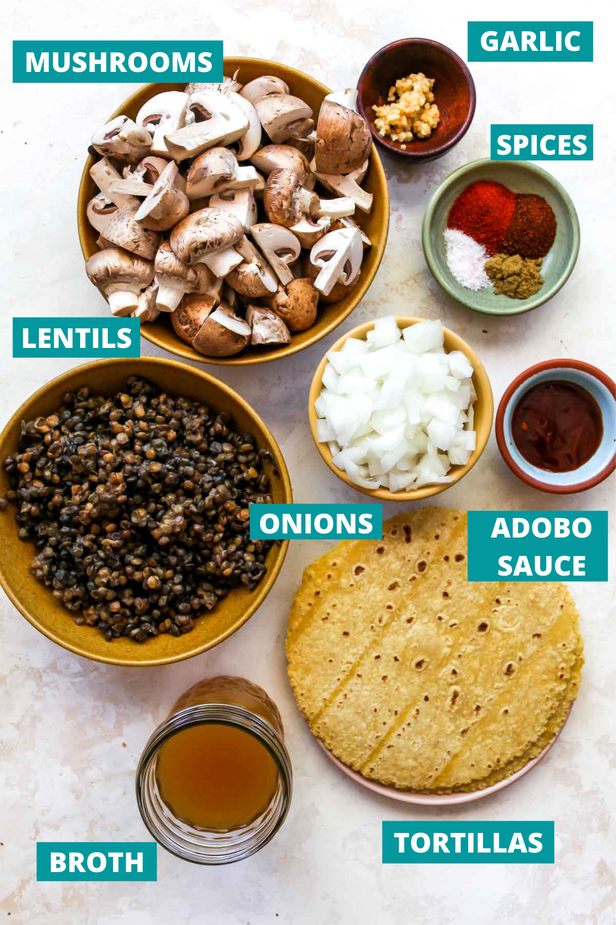 Veggie taco ingredients in separate bowls with blue labels