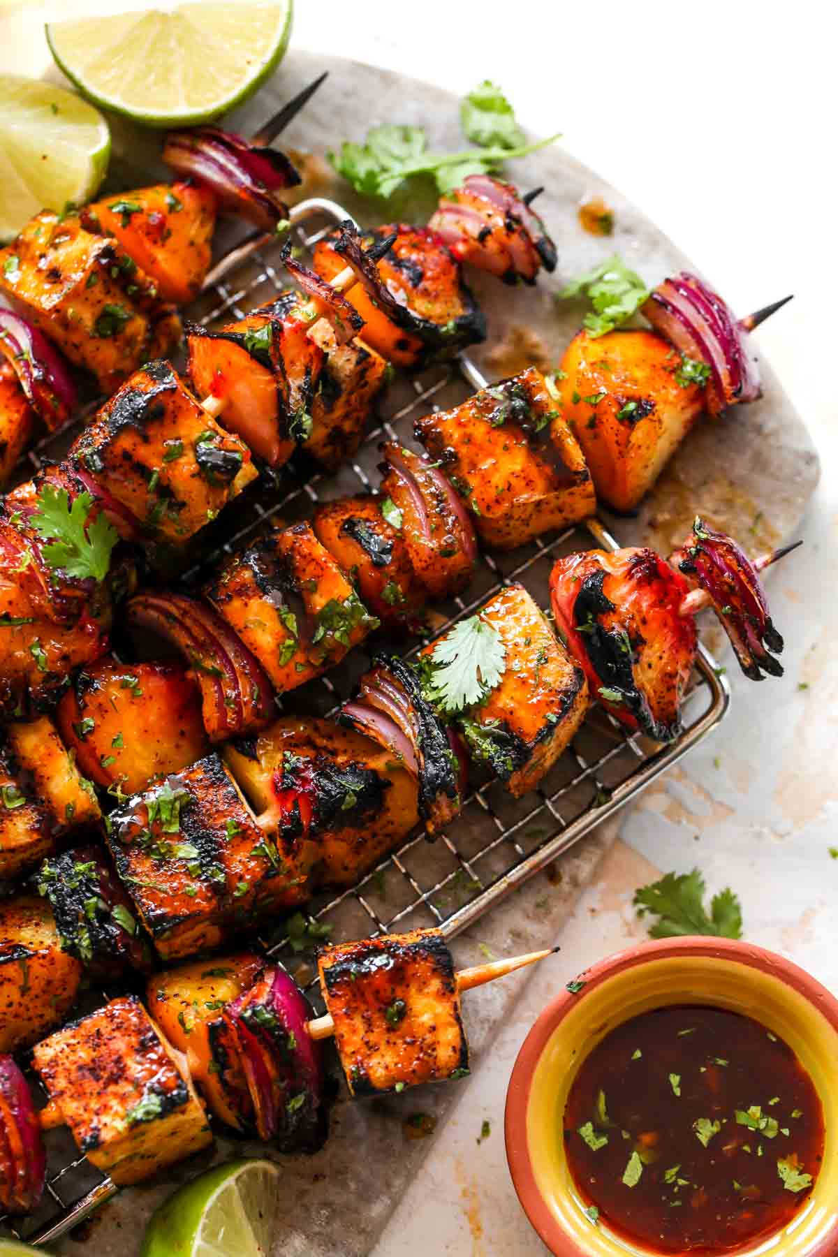Tofu skewers topped with chili glaze and cilantro