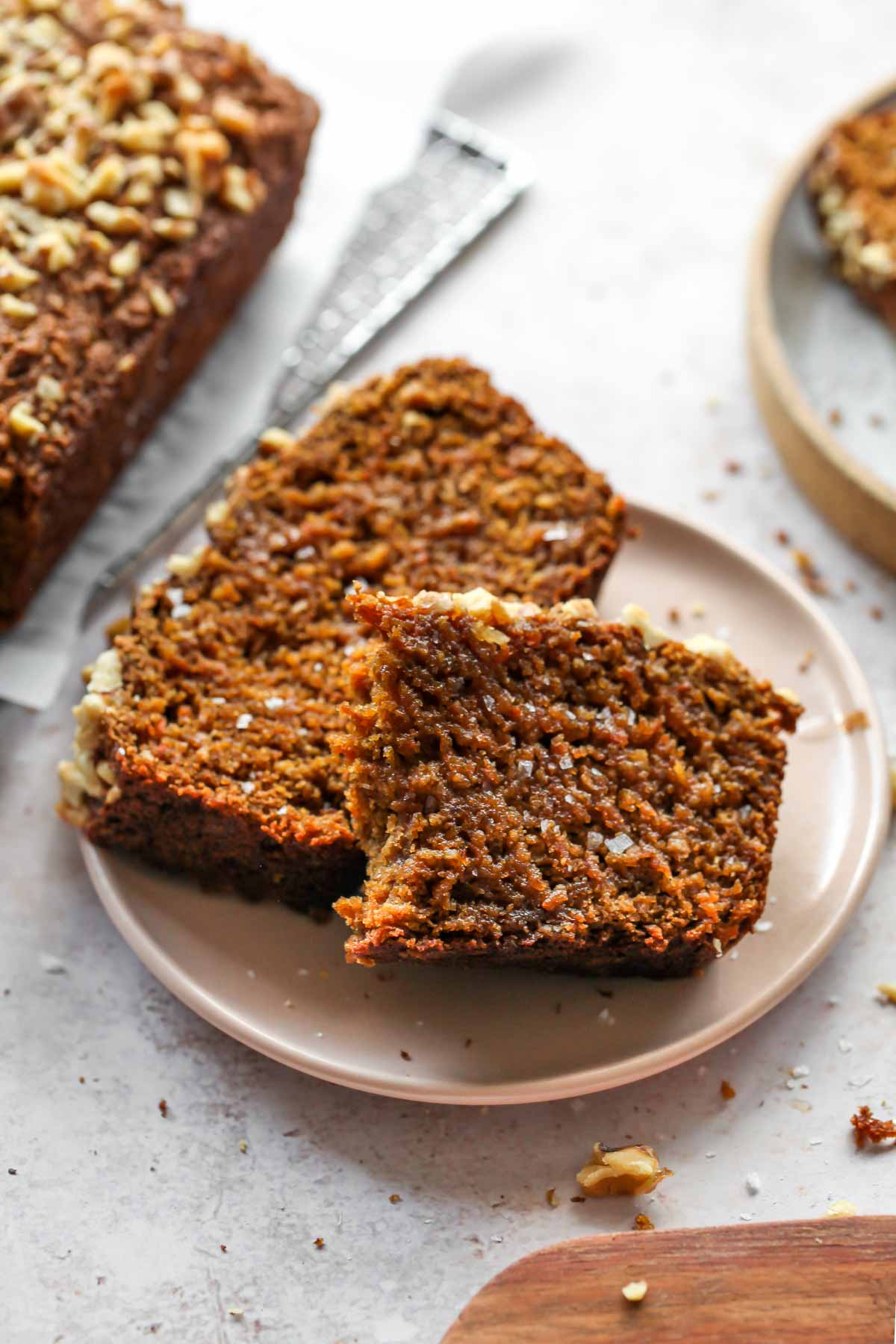Sliced apple walnut bread on a pink plate
