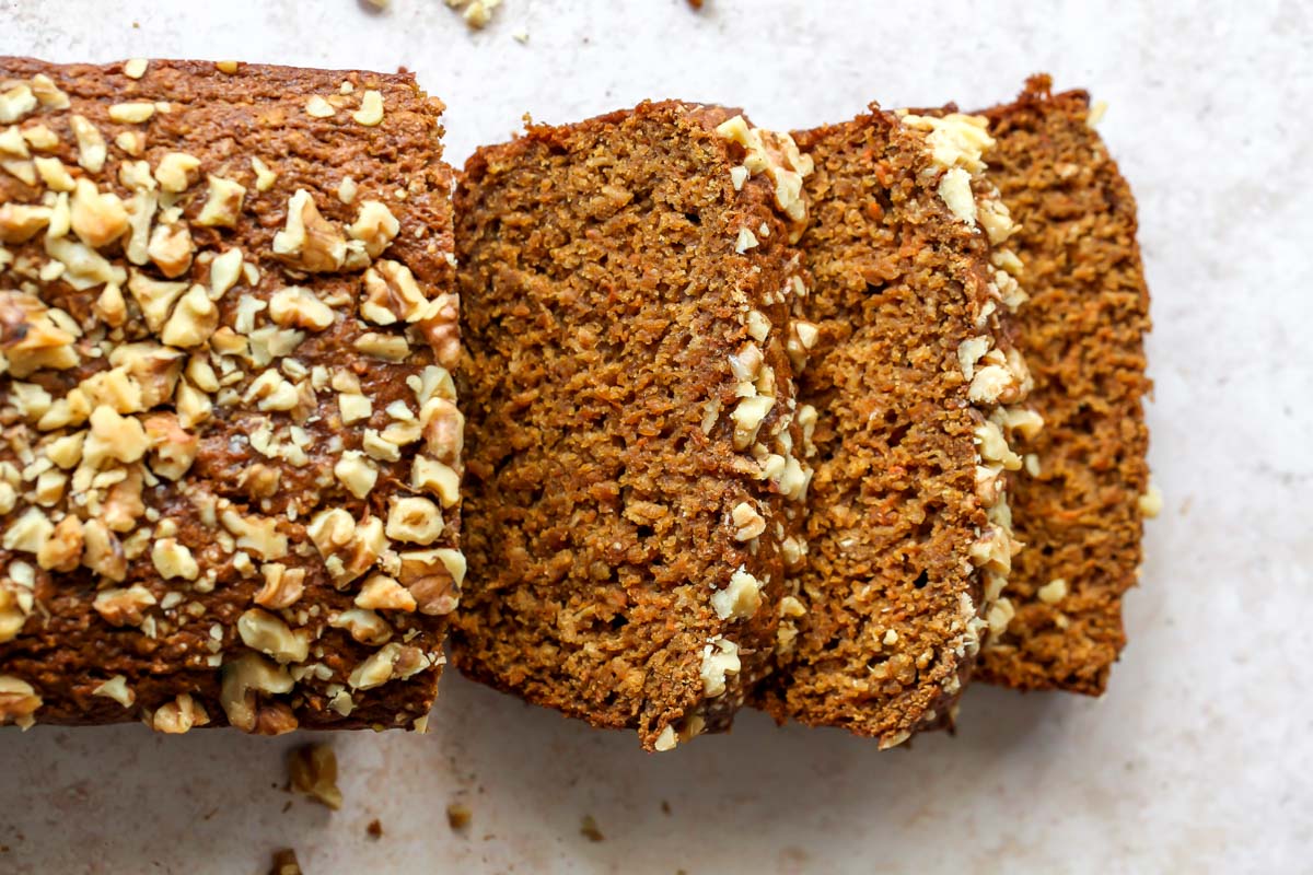 Loaf of carrot apple bread being sliced