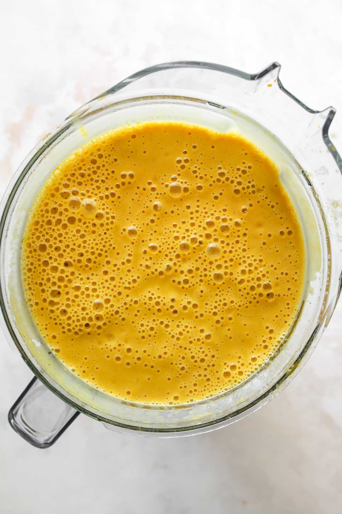 Butternut squash and apple soup being blended until smooth