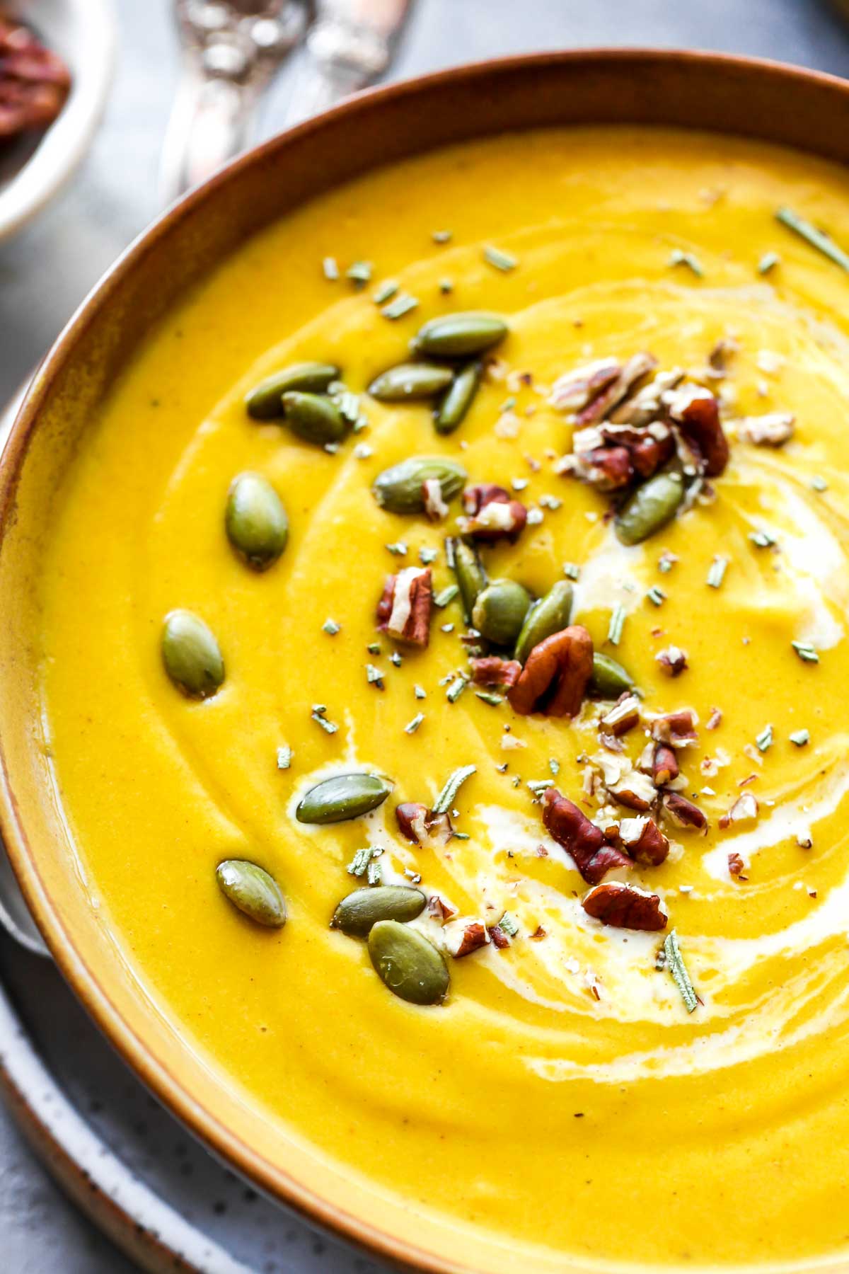 Cream swirl on the top of butternut squash soup