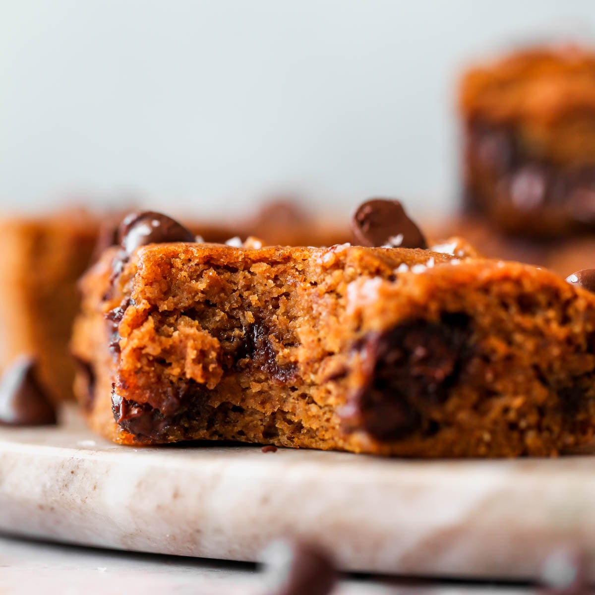 One pumpkin bar with a bite taken out of the side.