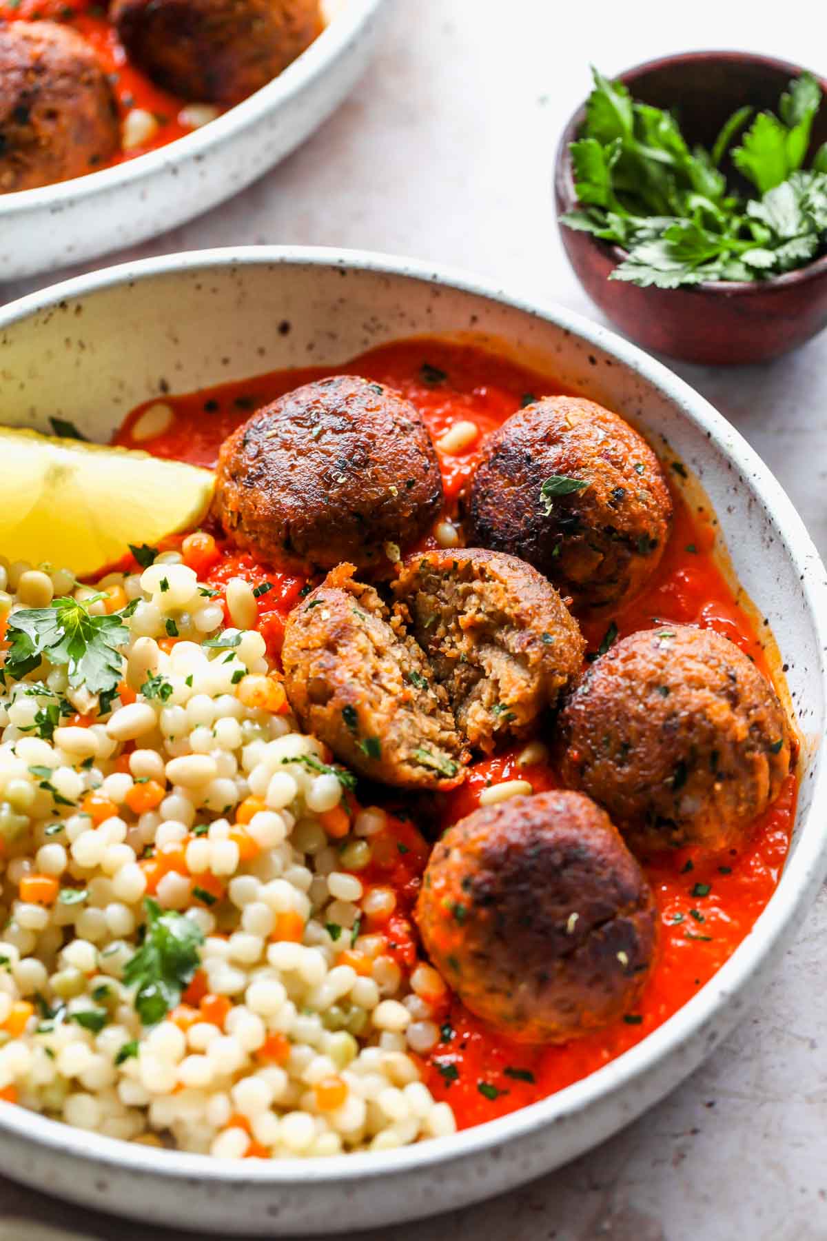 Lentil meatball being cut in half