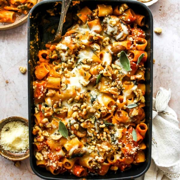 Cheesy pumpkin pasta bake with mushrooms, spinach, creamy pumpkin tomato sauce