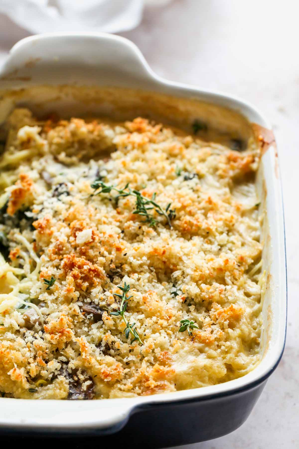Spaghetti squash and goat cheese casserole in a blue baking dish