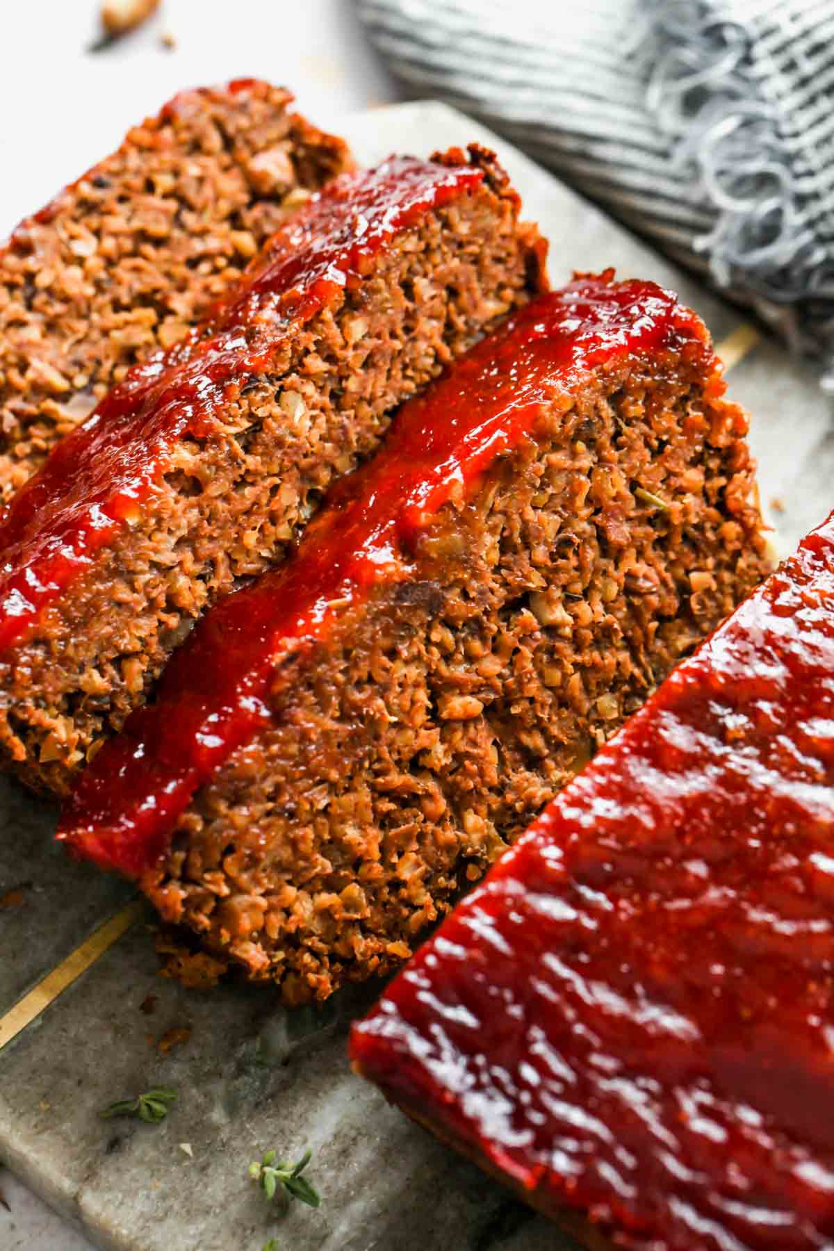 Vegetarian meatloaf sliced on a cutting board