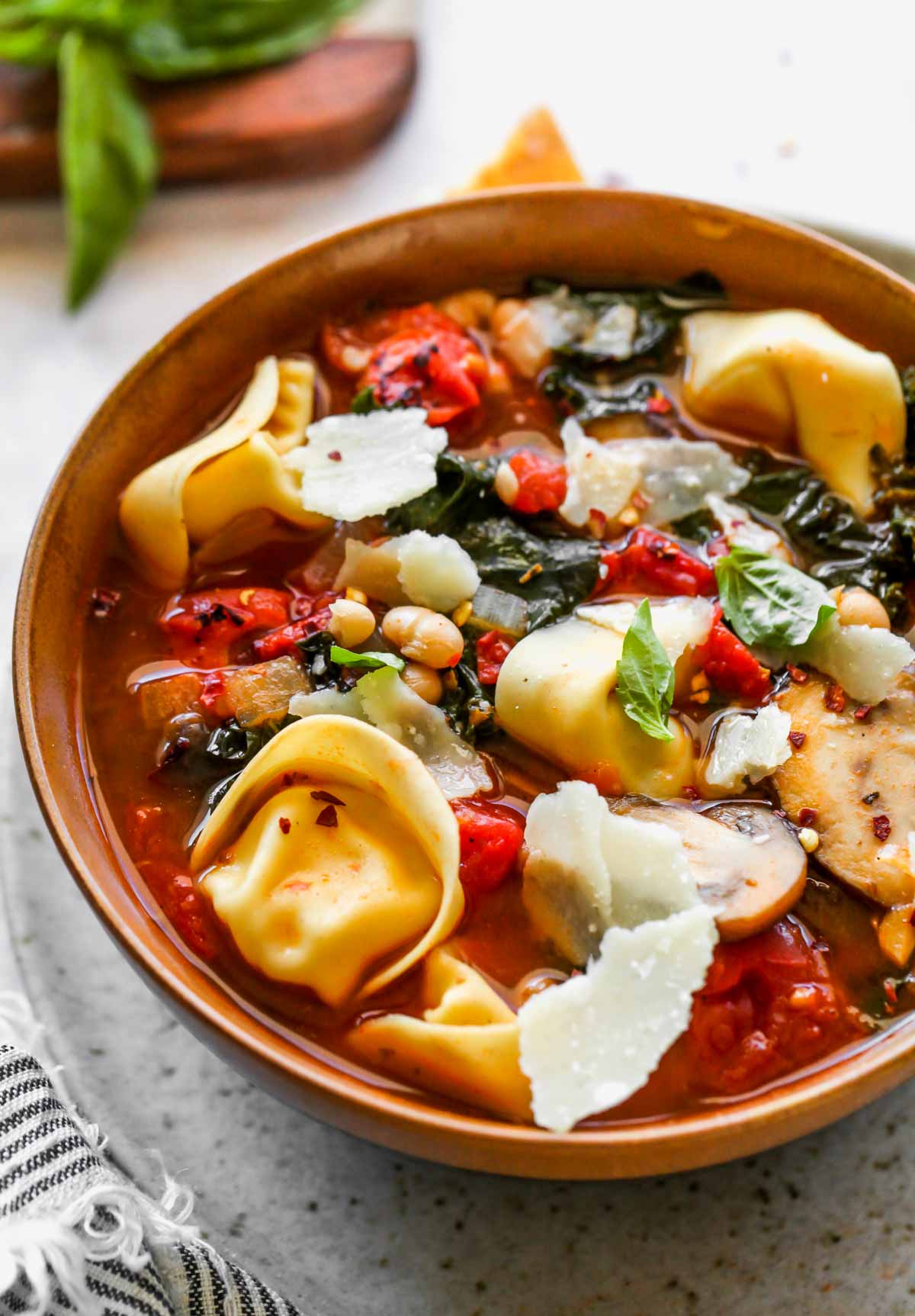 Parmesan cheese grated over a bowl of soup